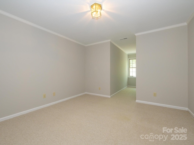 unfurnished room featuring light carpet, baseboards, ornamental molding, and visible vents