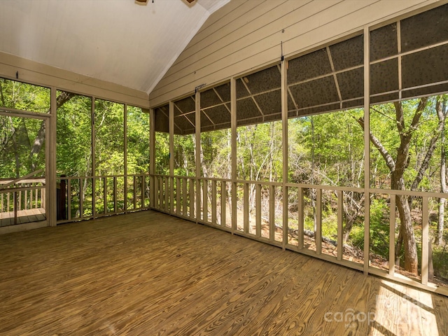 unfurnished sunroom with a ceiling fan