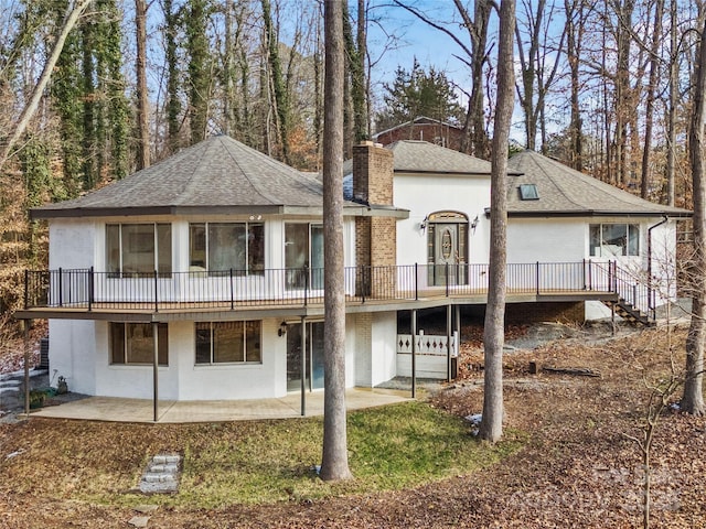 rear view of house featuring a patio area