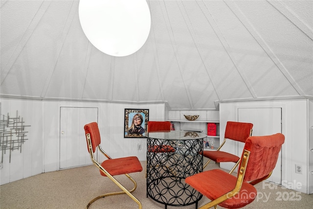 sitting room with carpet and lofted ceiling