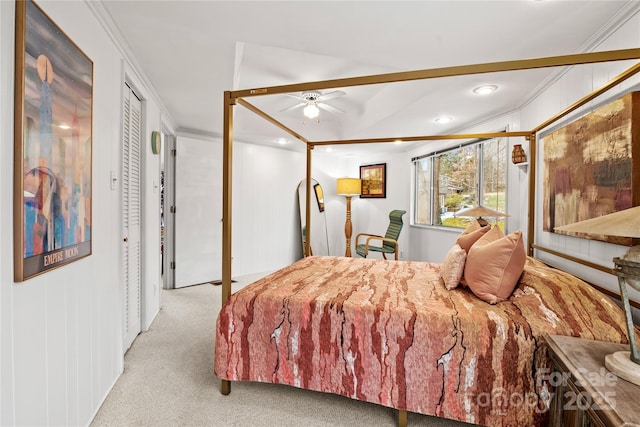 carpeted bedroom featuring ceiling fan and crown molding