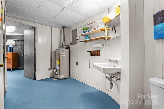 utility room featuring water heater and sink