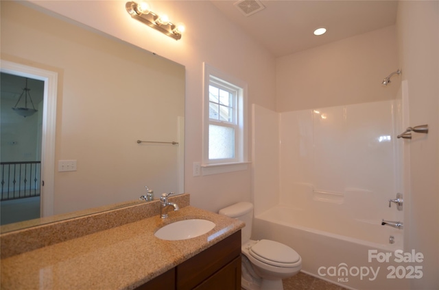 full bathroom featuring toilet,  shower combination, and vanity