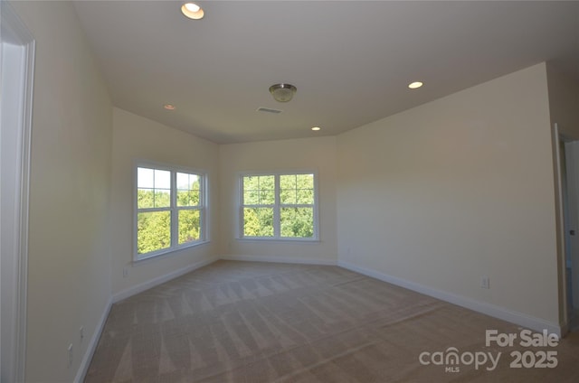 spare room featuring carpet floors