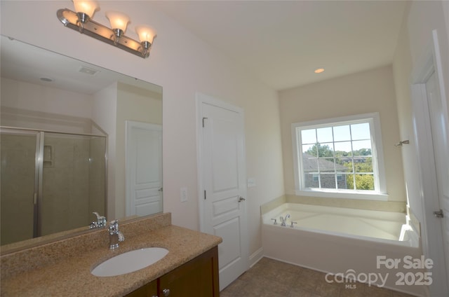 bathroom with tile patterned floors, separate shower and tub, and vanity