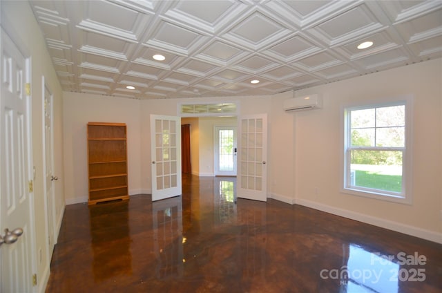 unfurnished room featuring coffered ceiling, french doors, and a wall mounted AC