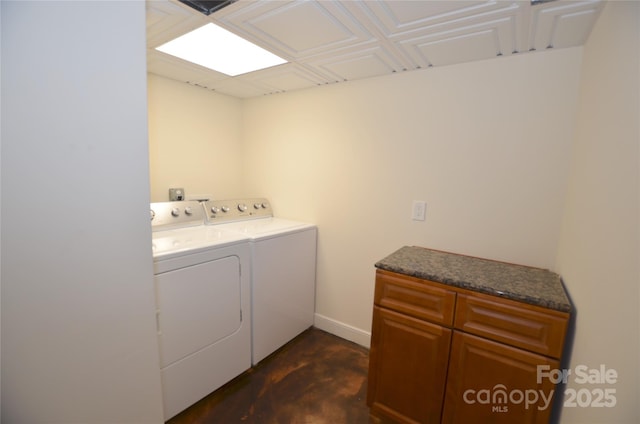 clothes washing area with washer and dryer