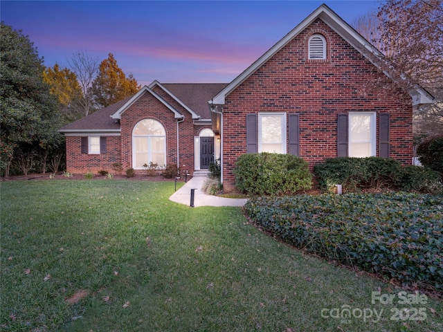 view of front of home with a lawn