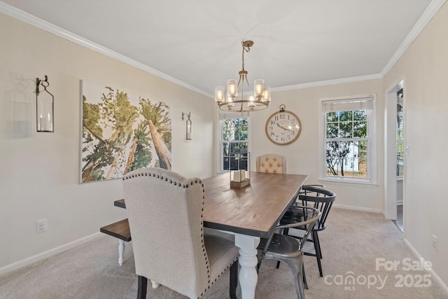 carpeted dining room featuring crown molding and a chandelier