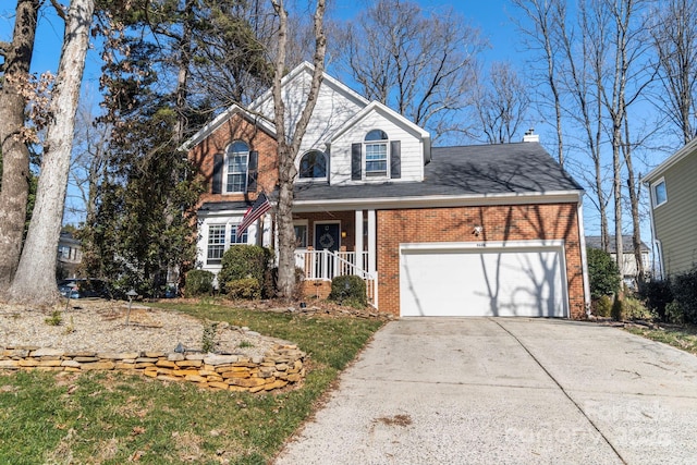 view of front property with a garage and a porch