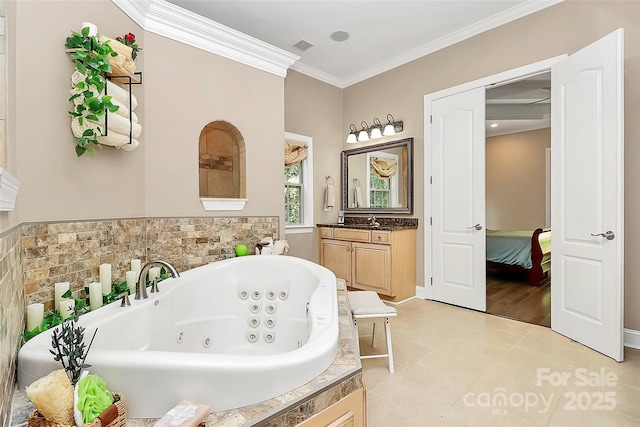 bathroom with ornamental molding, tile patterned floors, vanity, and a tub