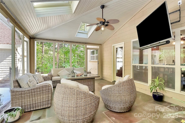 sunroom with lofted ceiling with skylight and ceiling fan