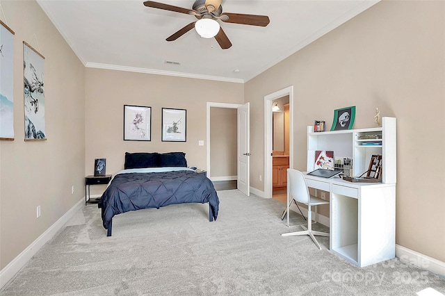 bedroom with ensuite bathroom, ornamental molding, light colored carpet, and ceiling fan