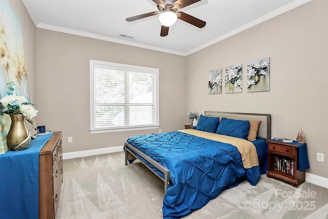 bedroom with crown molding, light colored carpet, and ceiling fan