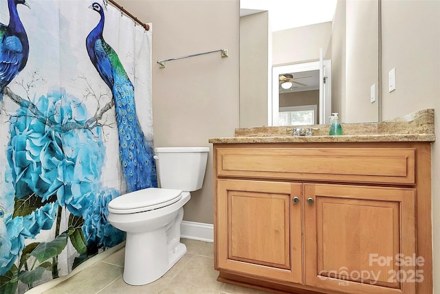 bathroom featuring tile patterned flooring, vanity, ceiling fan, toilet, and a shower with curtain