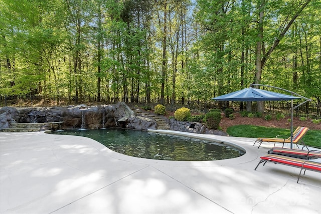 view of pool featuring a patio area