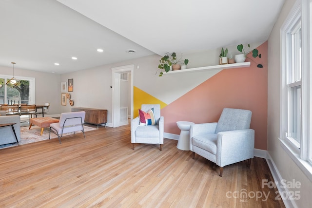 sitting room with light hardwood / wood-style flooring