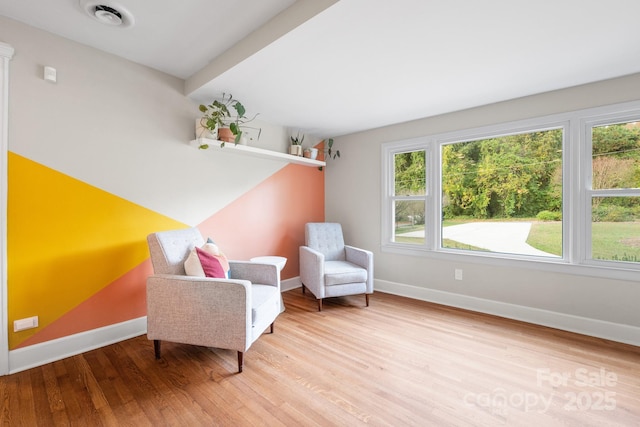 sitting room with light hardwood / wood-style floors