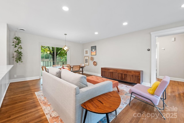 living room with dark hardwood / wood-style floors