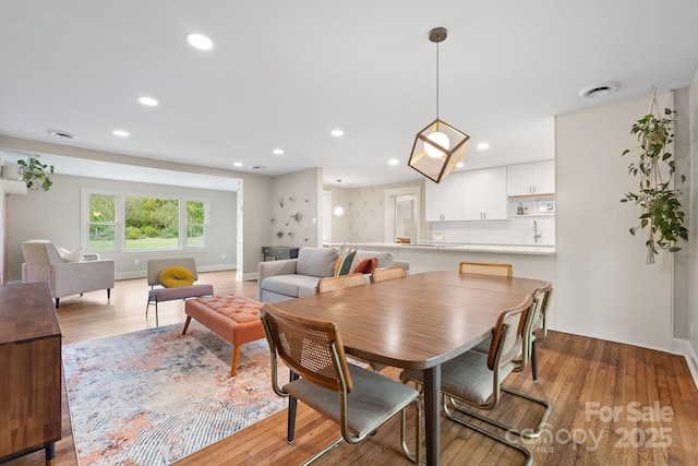 dining room with light hardwood / wood-style flooring