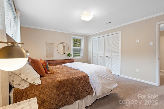 carpeted bedroom featuring a closet and ornamental molding