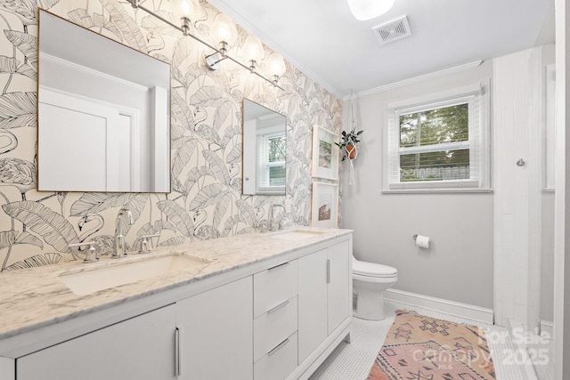 bathroom with toilet, vanity, tile patterned floors, and ornamental molding