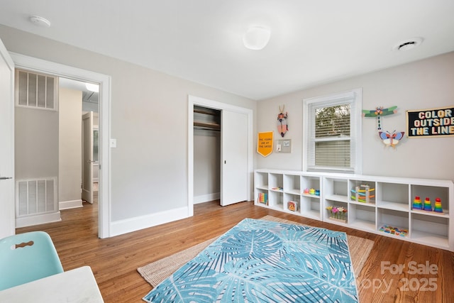 playroom featuring hardwood / wood-style floors