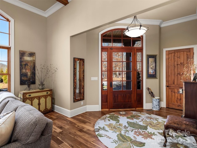 foyer entrance featuring dark hardwood / wood-style flooring and crown molding