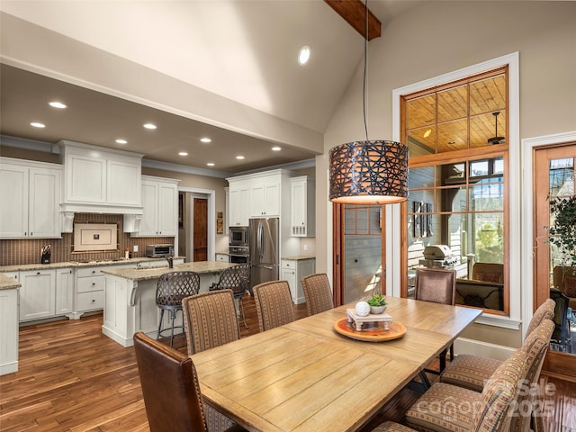 dining space with wood-type flooring