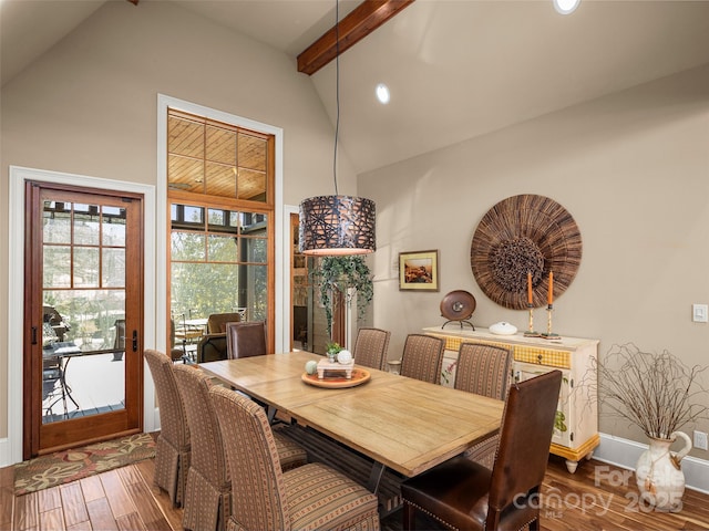 dining room with beam ceiling, dark hardwood / wood-style flooring, and high vaulted ceiling