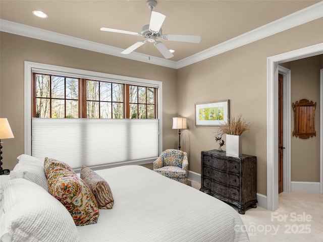 carpeted bedroom with ceiling fan, multiple windows, and ornamental molding