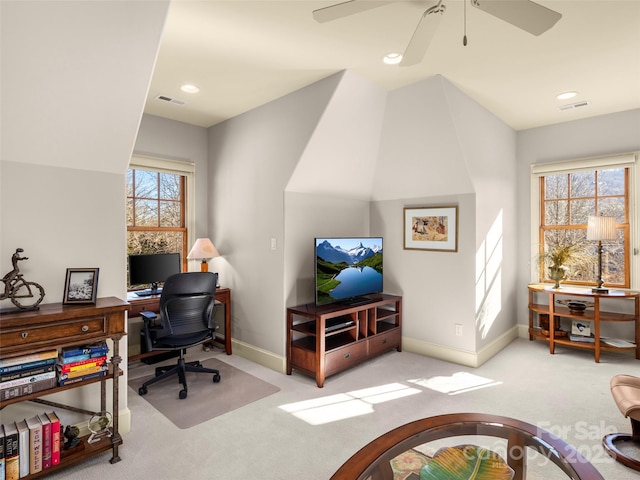 office with ceiling fan, light colored carpet, and lofted ceiling