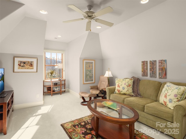 carpeted living room featuring ceiling fan and lofted ceiling