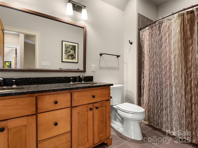 bathroom with toilet, vanity, a shower with shower curtain, and tile patterned flooring