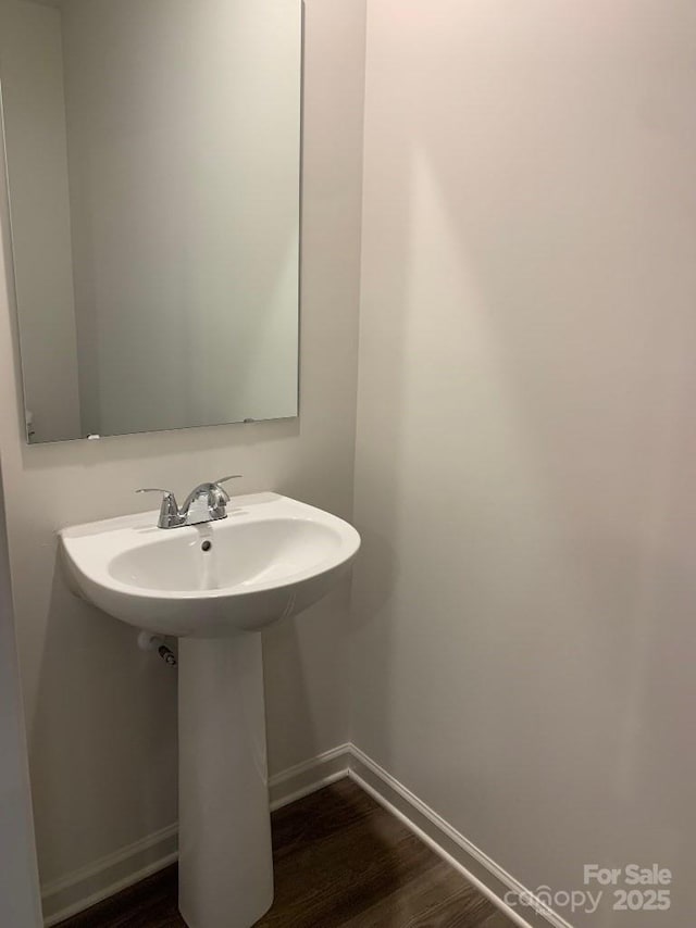 bathroom featuring sink and wood-type flooring