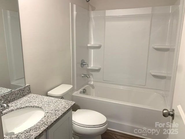 full bathroom featuring toilet, shower / bath combination, and vanity