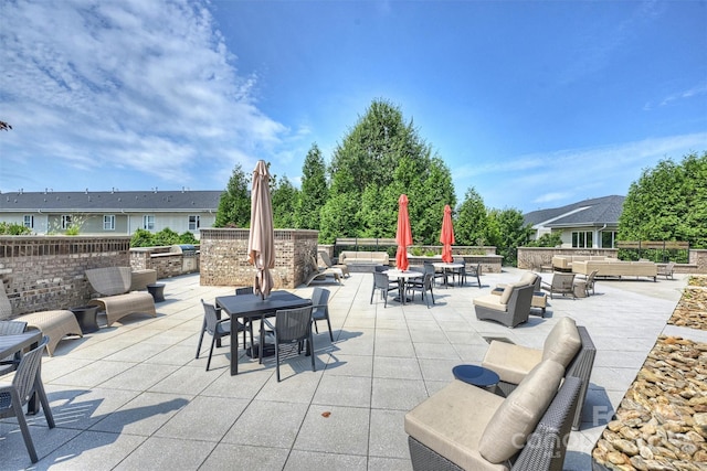 view of patio featuring an outdoor living space and exterior kitchen