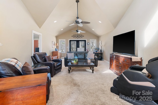 carpeted living room with high vaulted ceiling and ceiling fan