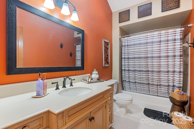 bathroom with vanity, tile patterned flooring, and toilet