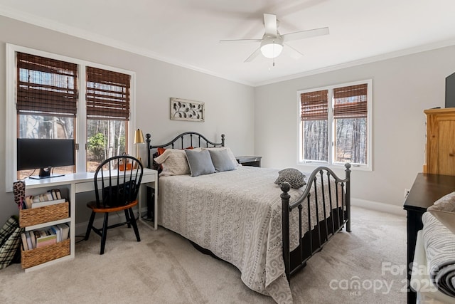 carpeted bedroom with crown molding and ceiling fan