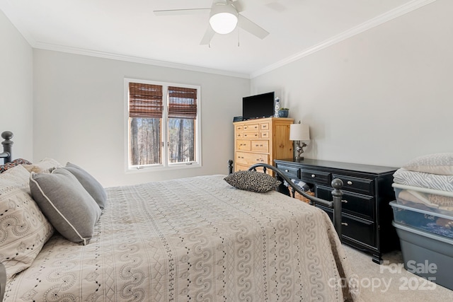 carpeted bedroom with crown molding and ceiling fan