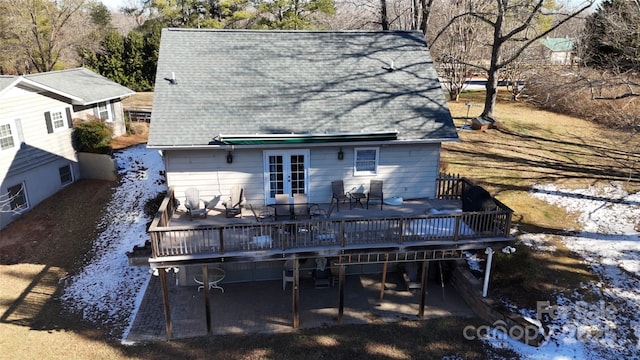 back of house with a deck and french doors