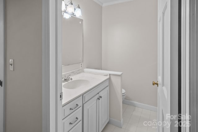 bathroom featuring tile patterned floors, toilet, vanity, and ornamental molding