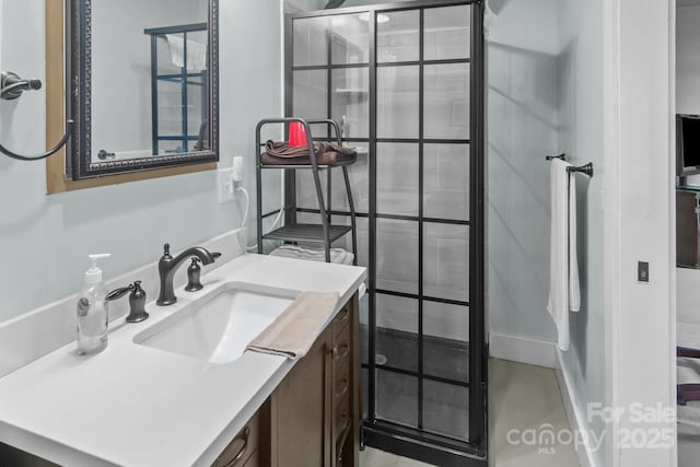 bathroom featuring walk in shower and vanity