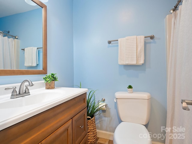 bathroom with toilet and vanity