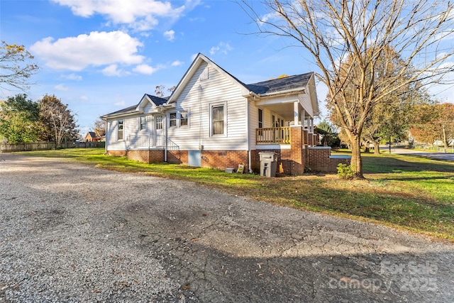 view of property exterior featuring a lawn