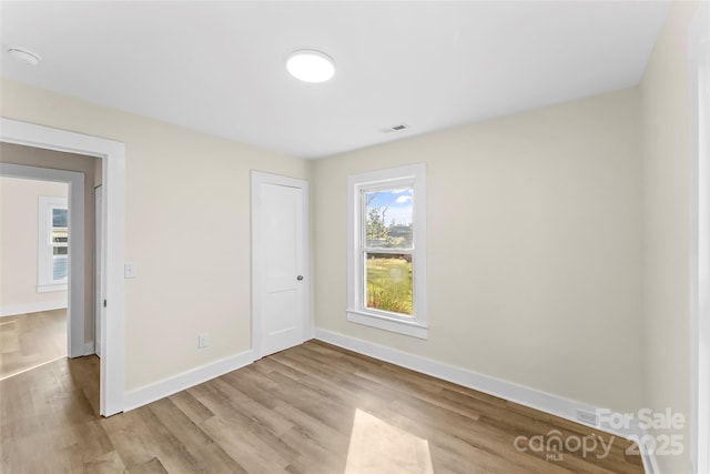 spare room with light wood-type flooring