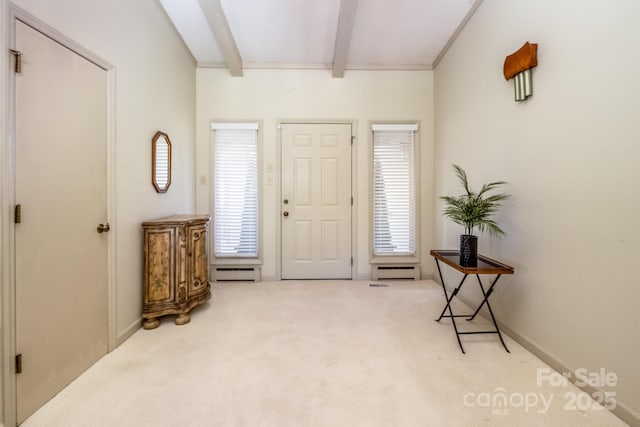 entryway featuring beam ceiling, light colored carpet, and a baseboard heating unit