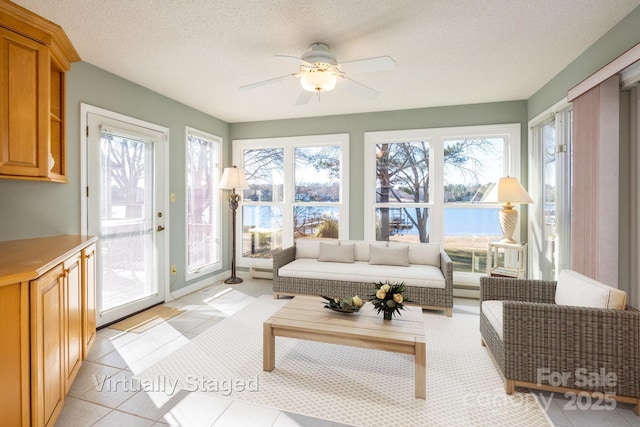 sunroom / solarium with ceiling fan