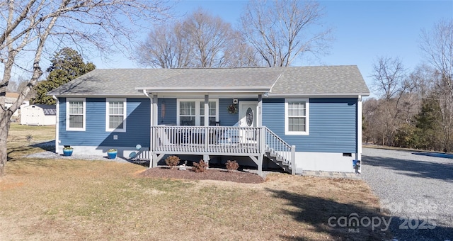 view of front of house with a porch and a front yard